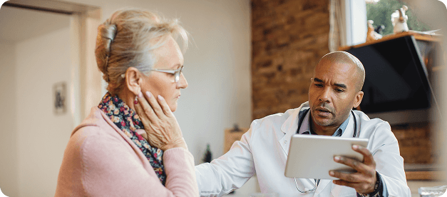 Doctor using laptop for prescription drafting