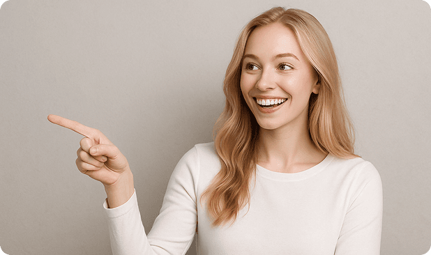 Professional woman in white sweater pointing left with a smile